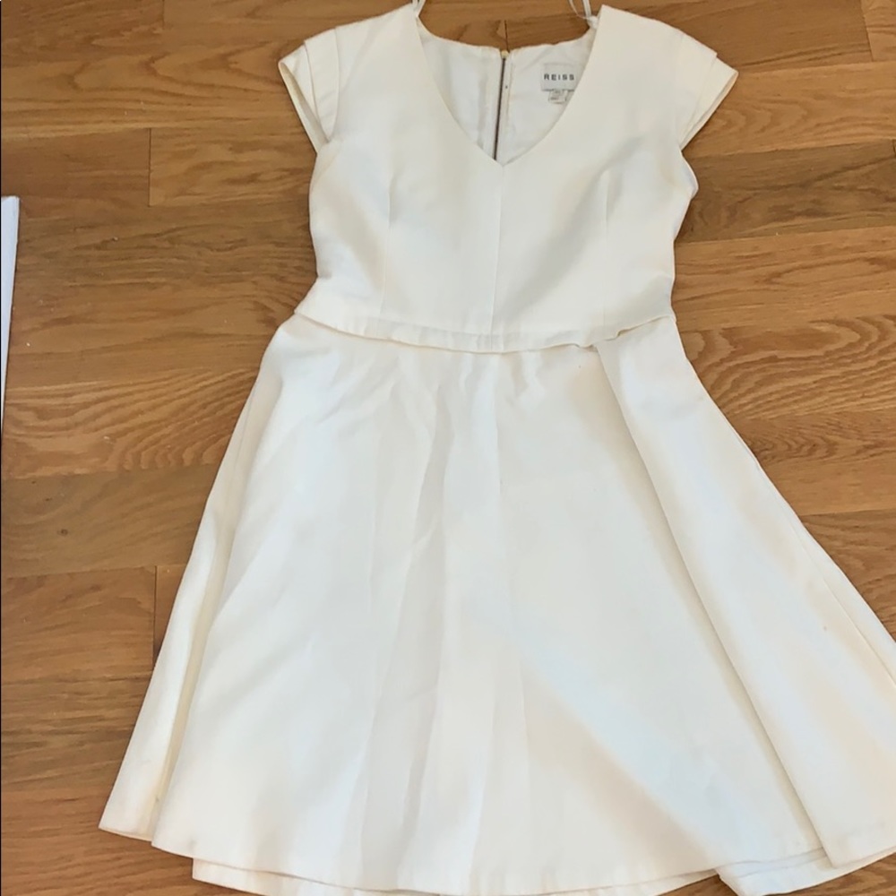 White dress with thick material.